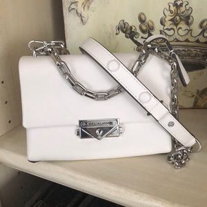 White Small Michael Kors Purse 7 inches wide 5 inches tall the inside stretches